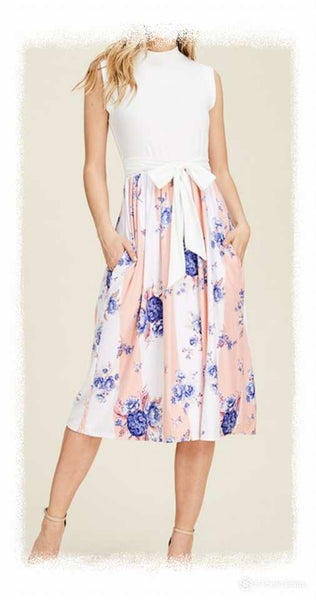 Sleeveless dress with solid top and floral vertical stripe bottom